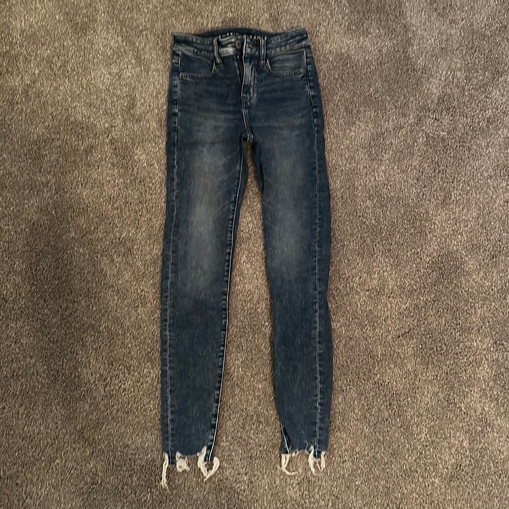 American Eagle Skinny Jeans. Distressed at the bottom of jeans.